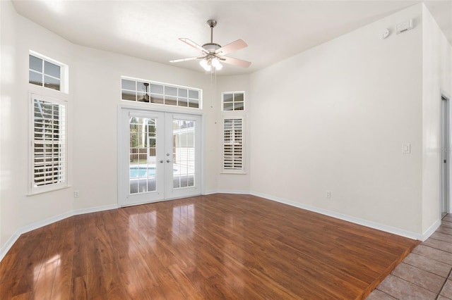 10303 SW 21st Ave, Gainesville, FL 32607 - empty room featuring french doors, ceiling fan, baseboards, and wood finished floors