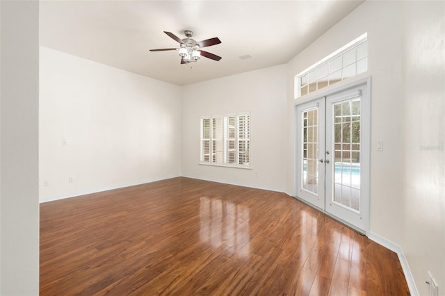 10303 SW 21st Ave, Gainesville, FL 32607 - unfurnished room with french doors, wood finished floors, ceiling fan, and baseboards