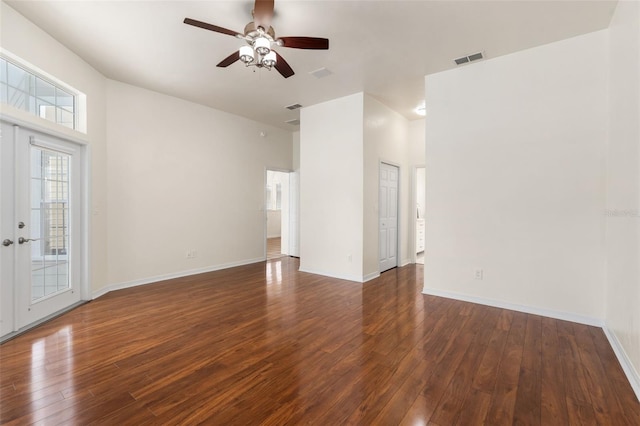 10303 SW 21st Ave, Gainesville, FL 32607 - spare room with dark wood-style floors, a ceiling fan, and baseboards