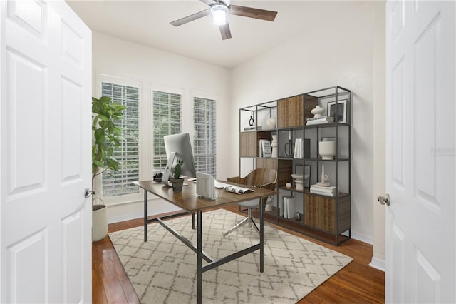 10303 SW 21st Ave, Gainesville, FL 32607 - office area featuring ceiling fan, wood finished floors, and baseboards