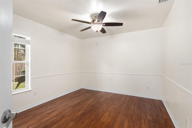 10303 SW 21st Ave, Gainesville, FL 32607 - spare room featuring wood finished floors, ceiling fan, and baseboards
