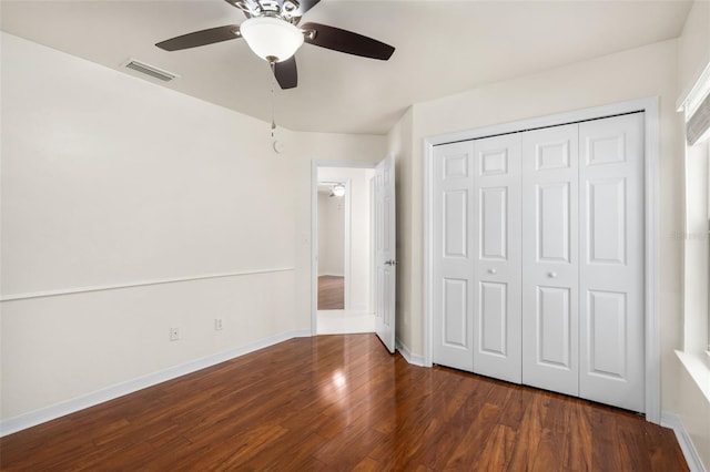 10303 SW 21st Ave, Gainesville, FL 32607 - unfurnished bedroom with wood finished floors, a closet, baseboards, and ceiling fan