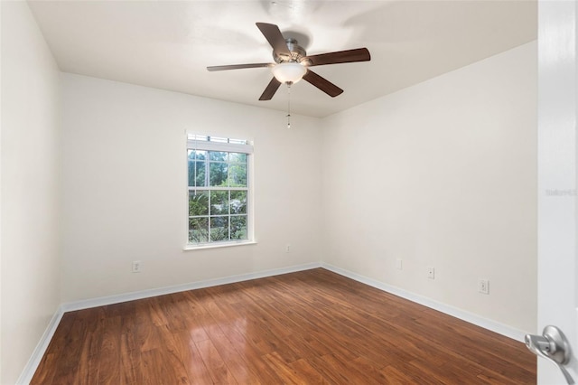 10303 SW 21st Ave, Gainesville, FL 32607 - unfurnished room with dark wood finished floors, a ceiling fan, and baseboards