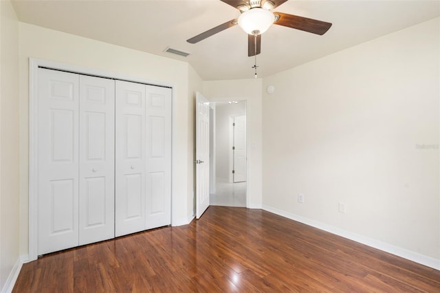 10303 SW 21st Ave, Gainesville, FL 32607 - unfurnished bedroom with wood finished floors, baseboards, and a closet