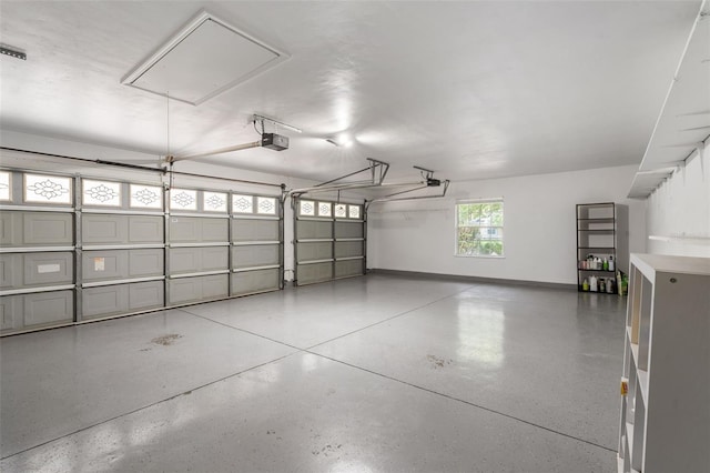 10303 SW 21st Ave, Gainesville, FL 32607 - garage with a garage door opener and baseboards
