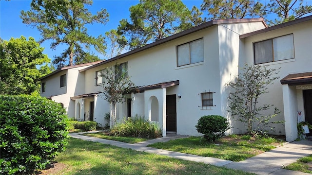2635 SW 35th Pl Unit 1705, Gainesville, FL 32608 - view of property featuring stucco siding