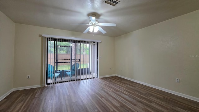 2635 SW 35th Pl Unit 1705, Gainesville, FL 32608 - spare room with dark wood-style flooring, ceiling fan, and baseboards