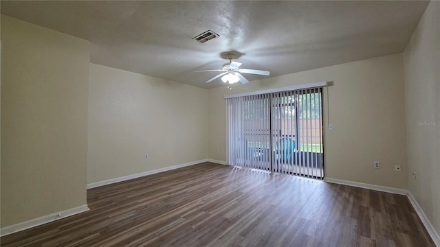2635 SW 35th Pl Unit 1705, Gainesville, FL 32608 - spare room featuring ceiling fan, dark wood-type flooring, and baseboards