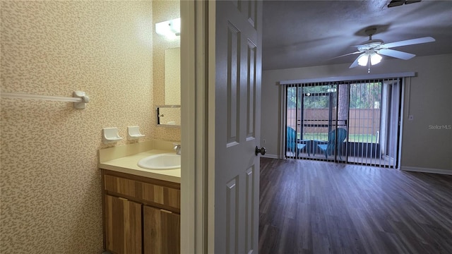2635 SW 35th Pl Unit 1705, Gainesville, FL 32608 - bathroom featuring vanity, ceiling fan, baseboards, and wood finished floors