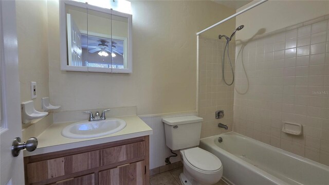 2635 SW 35th Pl Unit 1705, Gainesville, FL 32608 - bathroom featuring toilet, vanity,  shower combination, ceiling fan, and tile patterned flooring