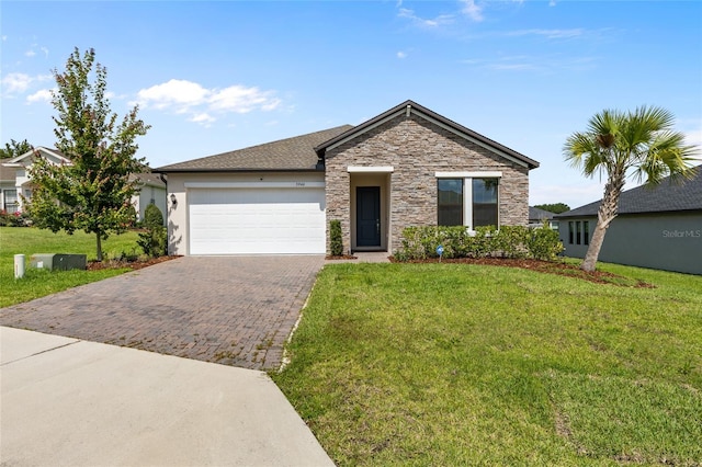 3940 SE 5th Ave, Ocala, FL 34480 - ranch-style house with decorative driveway, stone siding, a garage, and a front yard