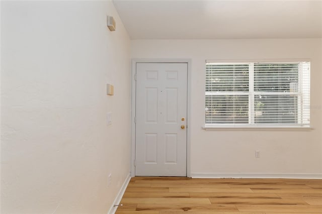 2360 SW Archer Rd Unit 204, Gainesville, FL 32608 - entrance foyer featuring light wood-type flooring and baseboards
