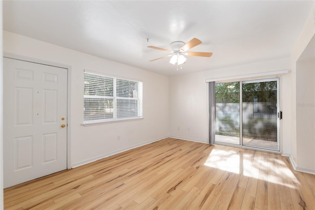 2360 SW Archer Rd Unit 204, Gainesville, FL 32608 - empty room featuring ceiling fan, wood finished floors, and baseboards