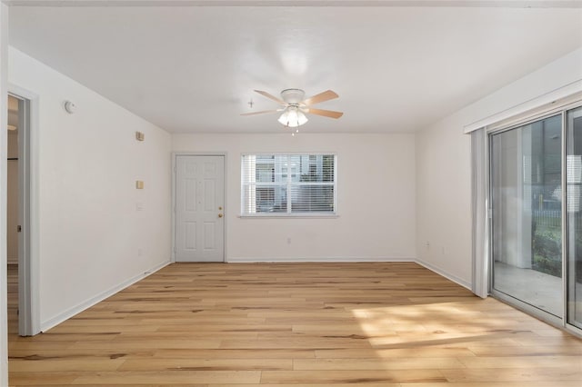 2360 SW Archer Rd Unit 204, Gainesville, FL 32608 - empty room with light wood finished floors, ceiling fan, baseboards, and a smoke detector