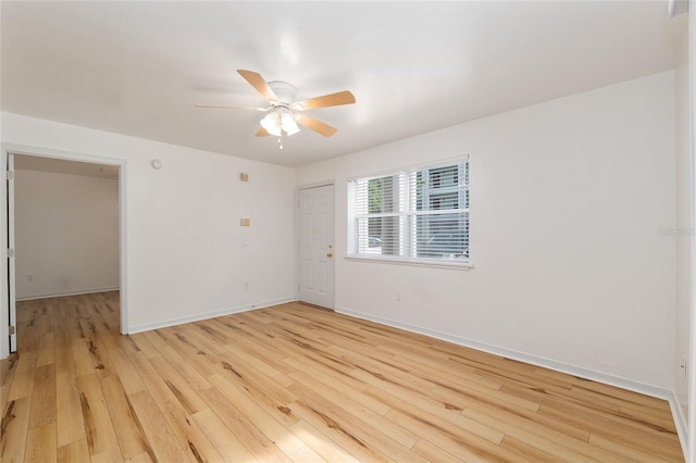 2360 SW Archer Rd Unit 204, Gainesville, FL 32608 - empty room featuring light wood finished floors, a ceiling fan, and baseboards