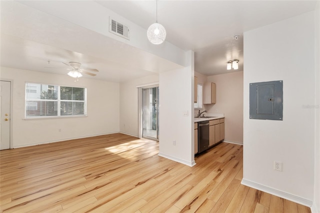 2360 SW Archer Rd Unit 204, Gainesville, FL 32608 - unfurnished living room featuring electric panel, a sink, light wood-style flooring, ceiling fan, and baseboards