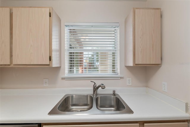 2360 SW Archer Rd Unit 204, Gainesville, FL 32608 - kitchen with light brown cabinetry, a sink, and light countertops