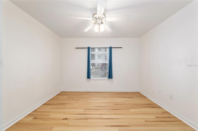 2360 SW Archer Rd Unit 204, Gainesville, FL 32608 - empty room featuring a ceiling fan, light wood finished floors, and baseboards