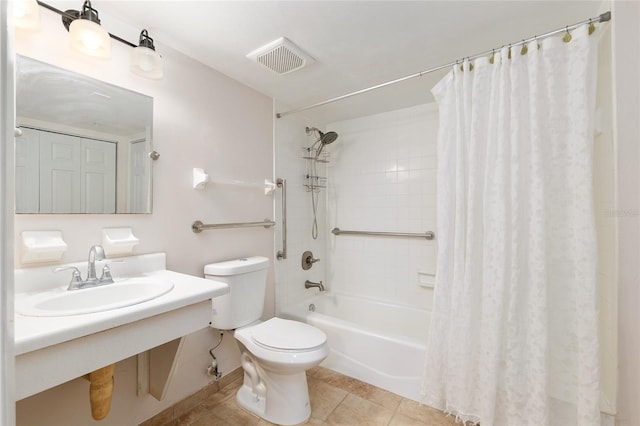2360 SW Archer Rd Unit 204, Gainesville, FL 32608 - full bathroom with toilet, shower / tub combo, tile patterned flooring, and vanity