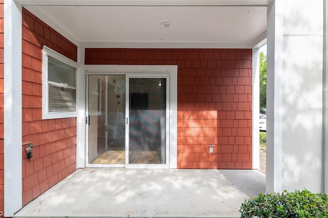 2360 SW Archer Rd Unit 204, Gainesville, FL 32608 - view of exterior entry featuring a patio area