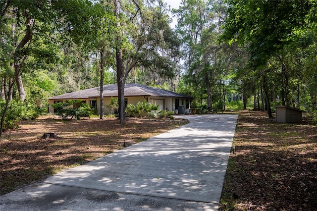 6425 NW 97th Ct, Gainesville, FL 32653 - view of front facade featuring concrete driveway and an attached garage