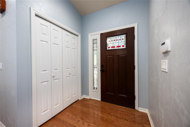 6425 NW 97th Ct, Gainesville, FL 32653 - entryway featuring wood finished floors and baseboards