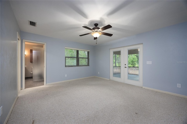 6425 NW 97th Ct, Gainesville, FL 32653 - carpeted empty room featuring french doors, ceiling fan, and baseboards
