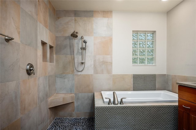 6425 NW 97th Ct, Gainesville, FL 32653 - bathroom with vanity, a bath, tiled shower, and tile walls