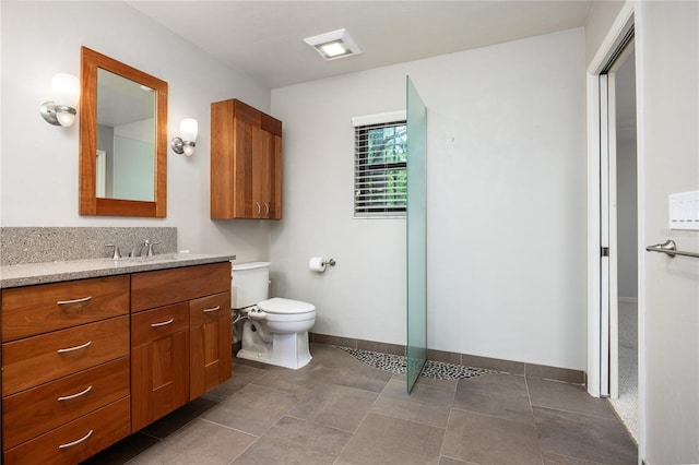 6425 NW 97th Ct, Gainesville, FL 32653 - bathroom featuring vanity, toilet, and baseboards