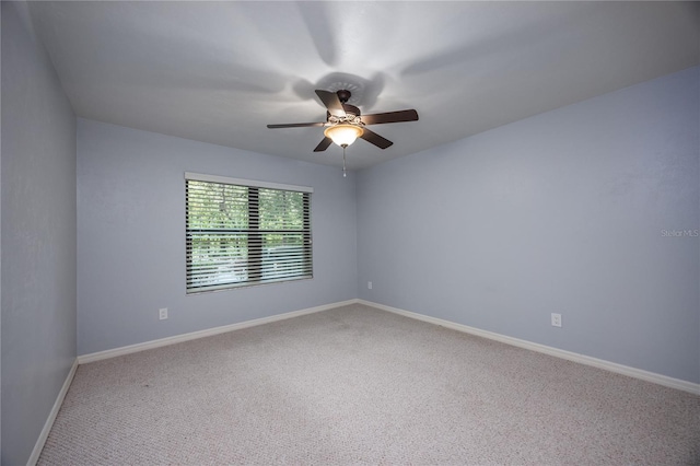 6425 NW 97th Ct, Gainesville, FL 32653 - carpeted empty room with a ceiling fan and baseboards