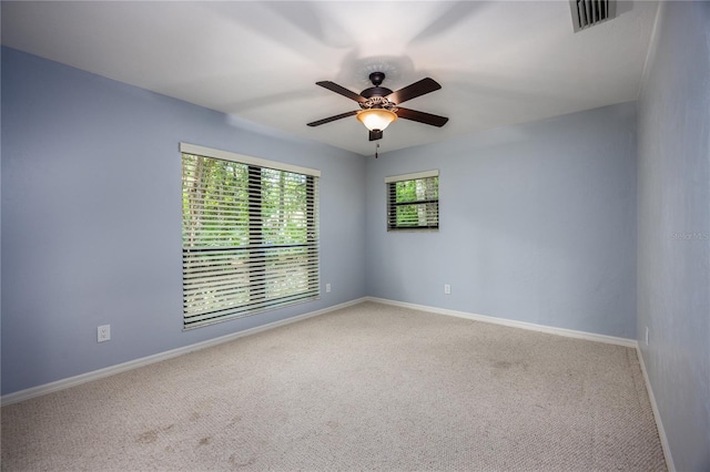 6425 NW 97th Ct, Gainesville, FL 32653 - carpeted empty room with a ceiling fan and baseboards