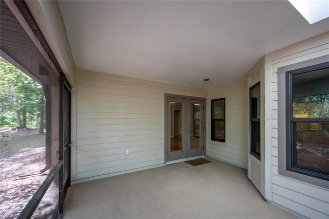 6425 NW 97th Ct, Gainesville, FL 32653 - unfurnished sunroom featuring french doors, plenty of natural light, and a skylight