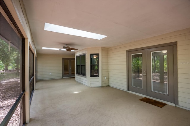 6425 NW 97th Ct, Gainesville, FL 32653 - unfurnished sunroom with french doors, a skylight, and ceiling fan