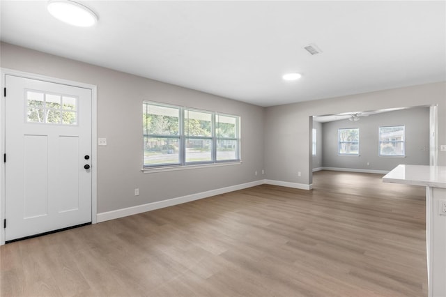 3237 NW 30th Ave, Gainesville, FL 32605 - entryway featuring light wood-style floors, baseboards, and a ceiling fan