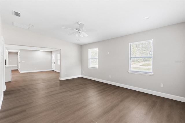 3237 NW 30th Ave, Gainesville, FL 32605 - empty room featuring ceiling fan, baseboards, and dark wood-style floors