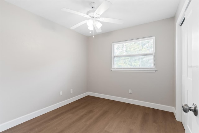 3237 NW 30th Ave, Gainesville, FL 32605 - unfurnished bedroom featuring wood finished floors, baseboards, a closet, and a ceiling fan