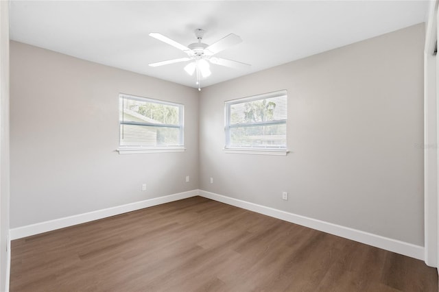 3237 NW 30th Ave, Gainesville, FL 32605 - spare room with wood finished floors, baseboards, and a ceiling fan