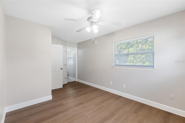 3237 NW 30th Ave, Gainesville, FL 32605 - unfurnished room with baseboards and wood finished floors