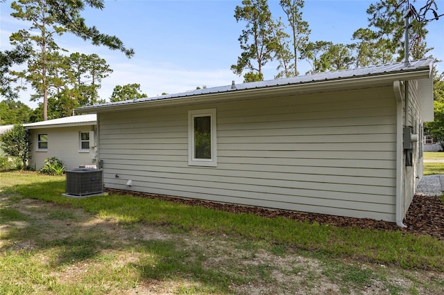 3237 NW 30th Ave, Gainesville, FL 32605 - view of home's exterior featuring central AC and metal roof