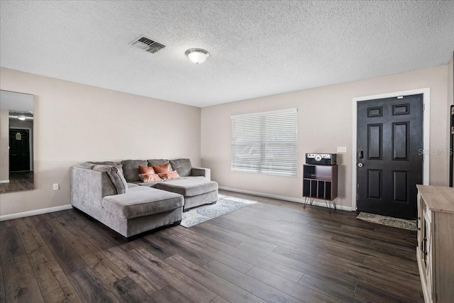 24 Sapphire Way, Ocala, FL 34472 - living area featuring dark wood finished floors, baseboards, and a textured ceiling