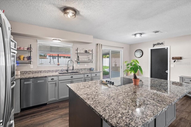 24 Sapphire Way, Ocala, FL 34472 - kitchen with dishwasher, open shelves, a sink, dark wood-type flooring, and a textured ceiling