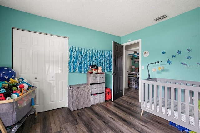 24 Sapphire Way, Ocala, FL 34472 - bedroom with wood finished floors, a closet, a textured ceiling, and a nursery area