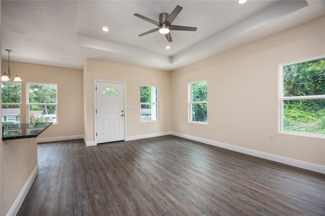 15217 NW 134th Ter, Alachua, FL 32615 - entrance foyer featuring a tray ceiling, dark wood-style flooring, recessed lighting, baseboards, and a ceiling fan