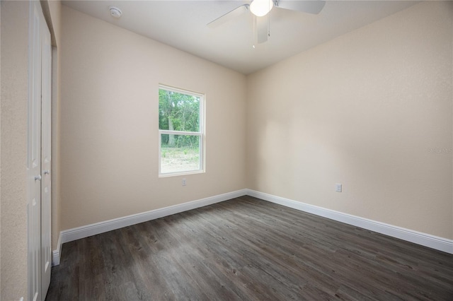 15217 NW 134th Ter, Alachua, FL 32615 - unfurnished bedroom with dark wood-style flooring, baseboards, and a ceiling fan