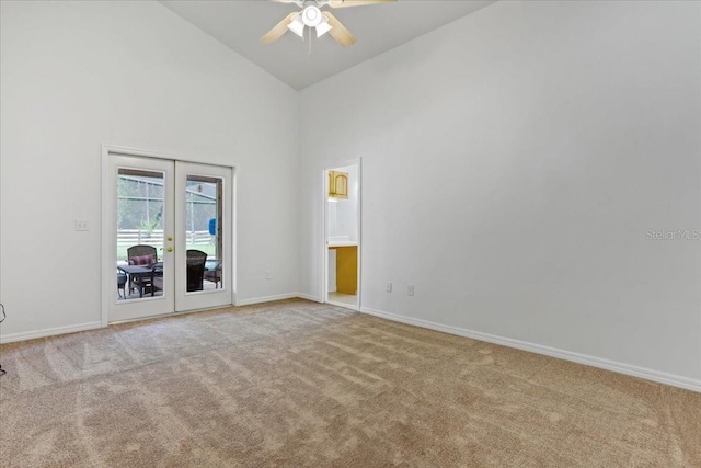 18028 NW 177th Ave, Alachua, FL 32615 - carpeted spare room featuring french doors, ceiling fan, baseboards, and high vaulted ceiling