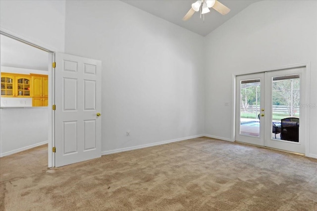 18028 NW 177th Ave, Alachua, FL 32615 - unfurnished room with high vaulted ceiling, carpet floors, french doors, a ceiling fan, and baseboards
