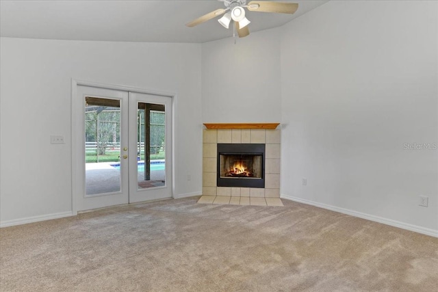18028 NW 177th Ave, Alachua, FL 32615 - unfurnished living room featuring french doors, carpet flooring, a ceiling fan, baseboards, and vaulted ceiling
