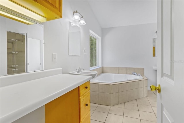 18028 NW 177th Ave, Alachua, FL 32615 - bathroom with a bath, vanity, tile patterned flooring, an enclosed shower, and vaulted ceiling