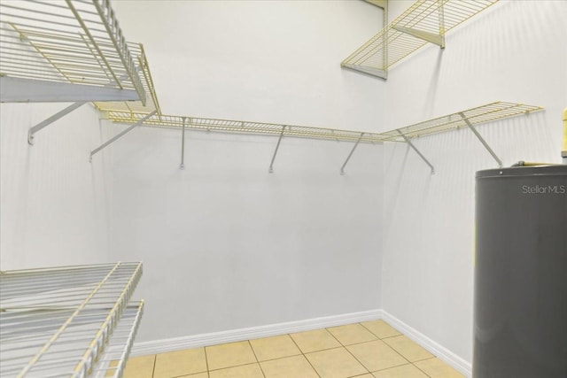 18028 NW 177th Ave, Alachua, FL 32615 - walk in closet featuring water heater and tile patterned flooring