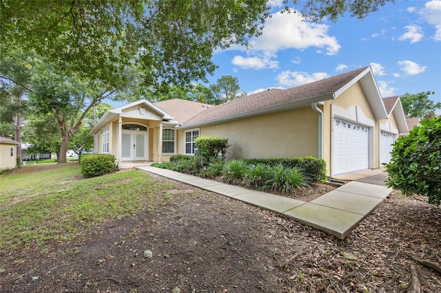 6516 NW 109th Pl, Alachua, FL 32615 - ranch-style house with french doors, stucco siding, a garage, and driveway